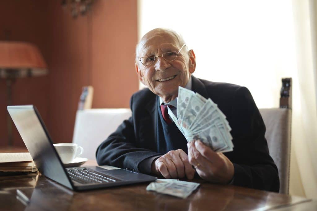 Elder figuring out how much money he can save with Medigap.